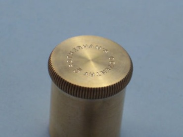 Engraved brass machinery end cap