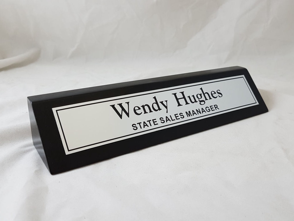 Black timber name bar with brushed aluminium coloured name plate