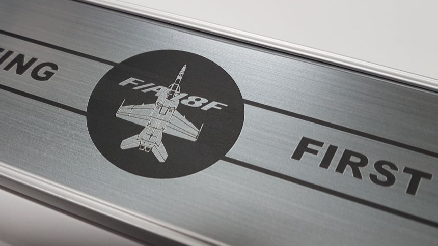 Brushed aluminium coloured sign panels with a logo