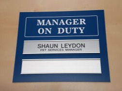 Manager on duty sign with changeable name slots